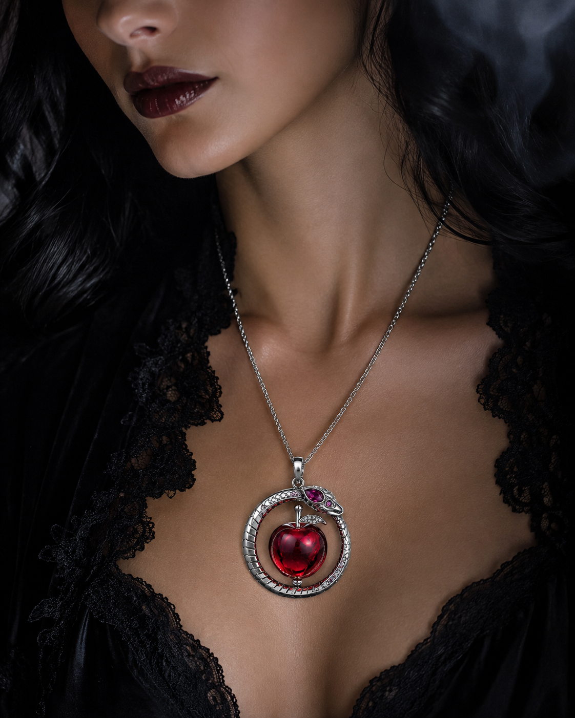 EDEN II silver ouroboros and red apple pendant worn with black lace
